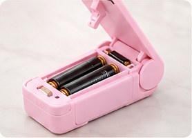 The open battery compartment of SnapSeal Mini